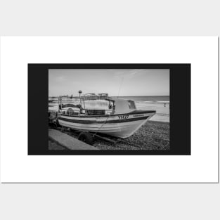 Traditional fishing boat on Cromer beach with the Victorian pier in the background Posters and Art